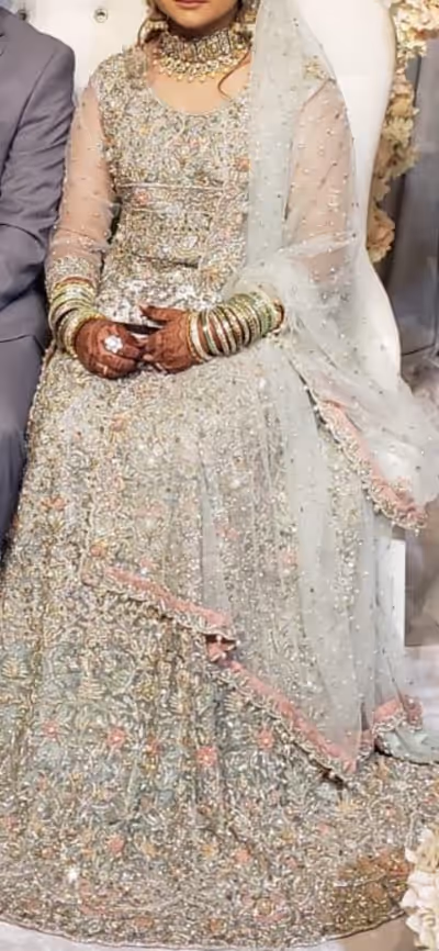 Beautiful mint colour bridal gown with heavy work on it Used only 1 time Size Chest : 38 Length :54...