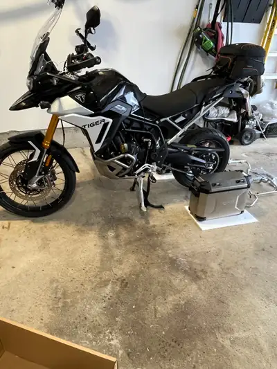 New, never installed Triumph Aluminum panniers with the required mounting hardware that came as part...