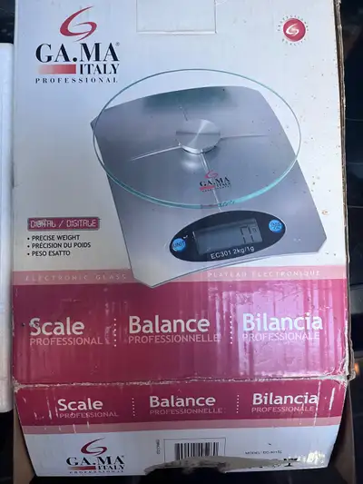This is a G.A.MA Italy professional digital electronic glass scale with a precise weight that can we...