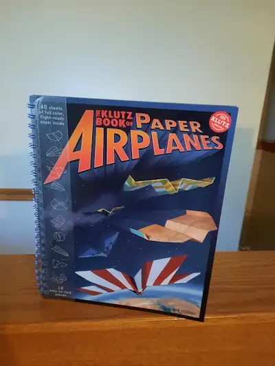 Brand new-Klutz book of paper airplanes. Bought for $25. Selling for $15 Text 403 874 4594 or 403 55...