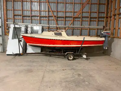 DS-16 Sailboat for sale with trailer and motor. Stored inside.
