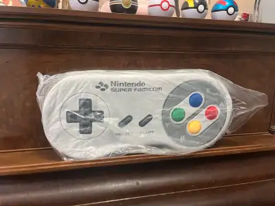 I am offering a rare Nintendo Museum Super Famicom controller plush cushion. Brand new in its origin...