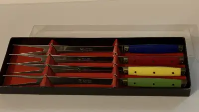 This is a set of 4 in their original box, 10” long They are unusual because of the full tang of the...