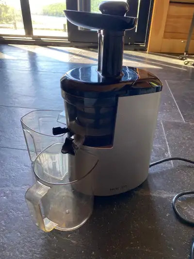 Hurom Slow Juicer Works great. Black and silver.