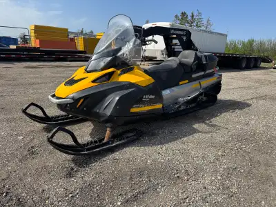 Wide 20” track, two-up, storage box in the rear, super wide powder skis, 600 ACE four stroke. Electr...