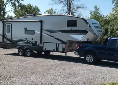 29’ sleeps 4. Includes 50” TV above electric fireplace and small TV/DVD in bedroom. Add on slide cov...