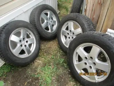 4 Certified Wintertrek snow tires near new on stock aluminum mags used on 2005 Dodge Grand Caravan 2...
