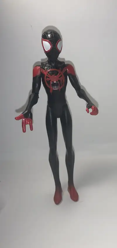 I'm selling a pre-owned Miles Morales action figure, ready to swing into action! This toy has been p...