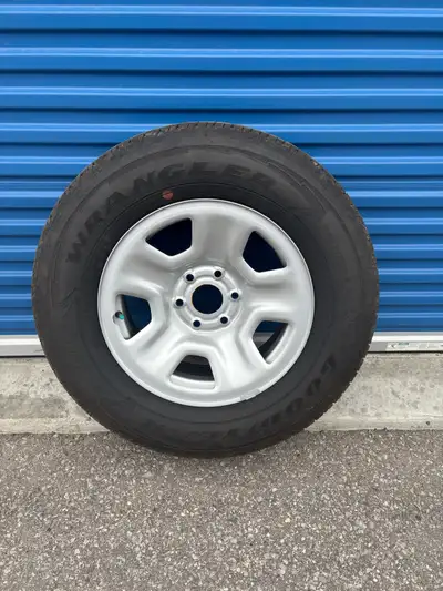 275/65/18 Brand new Goodyear wrangler tires on aluminum 6 bolt rims, came off of a 2024 ram 1500.