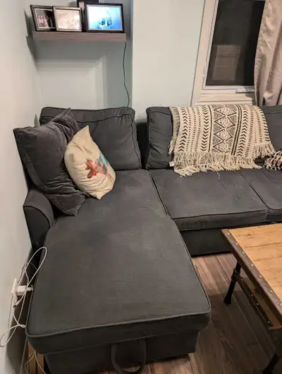 Grey couch for sale. Enough seating room for 3 to 4 people comfortably. Couch pulls out into a bed,...