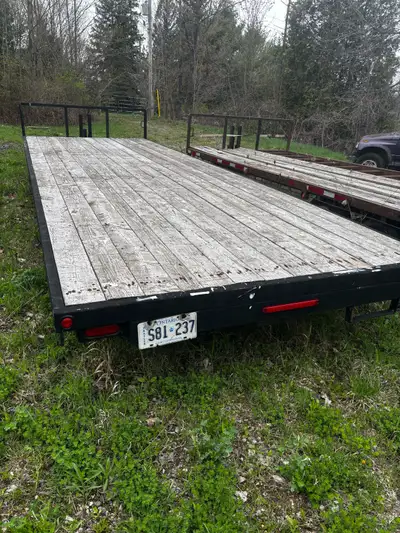 24’ flat bed trailer. tandem 3500lb axles with electric brakes. tires are all good. held air all win...