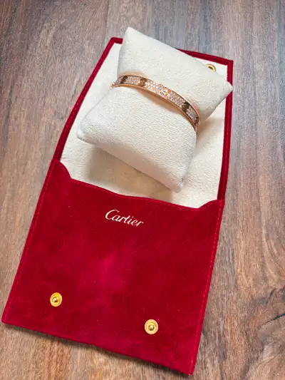 This is a lightly used Cartier Love bracelet, classic model, paved. It is made of 18K rose gold and...
