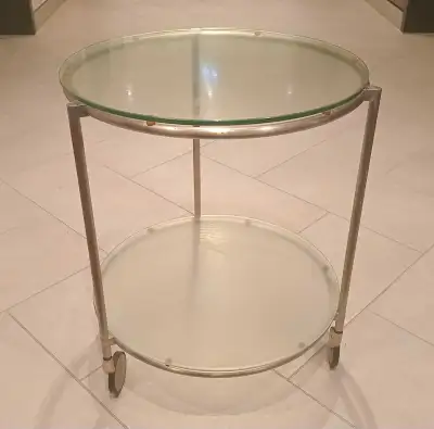 Vintage 2 tier serving trolley on wheels designed by Ehlen Johansson. Diameter of glass top: 19.5" (...