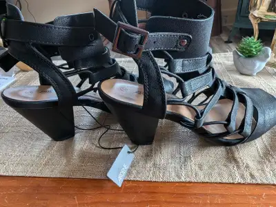 Women's Size 7 shoes, the black ones have never been worn, the other two have been worn once. All th...