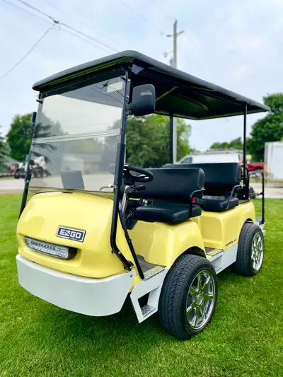 EZGO shuttle 48volt. Completely custom rebuilt from the ground up. 16 inch Cadillac aluminum wheels,...