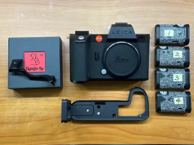 Leica SL2S with box, 4 batteries, thumbs up, and quick L bracket Mint condition SL2S. Low shutter co...