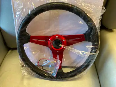 Brand new 14” custom steering wheel, new in box. $75. Please contact