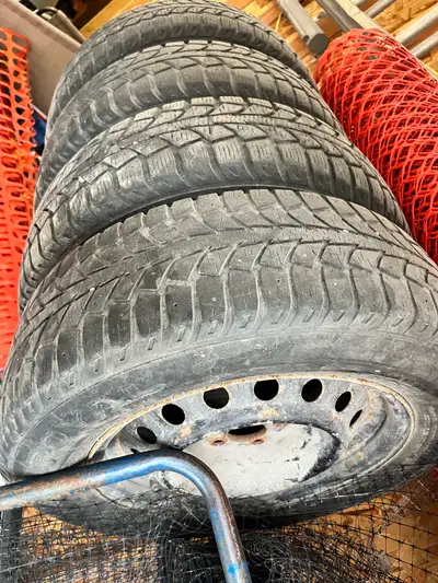 I am selling a set of four Corolla snow tires, size 195/65R15, mounted on rims. These tires are old...