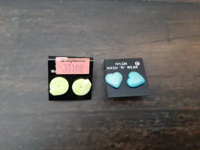 Two sets of earrings, one in aqua and one in light green. For pierced ears. Never worn. Card with 5...