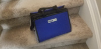 Soft sided tool bag with sets of drills, screwdriver bits etc