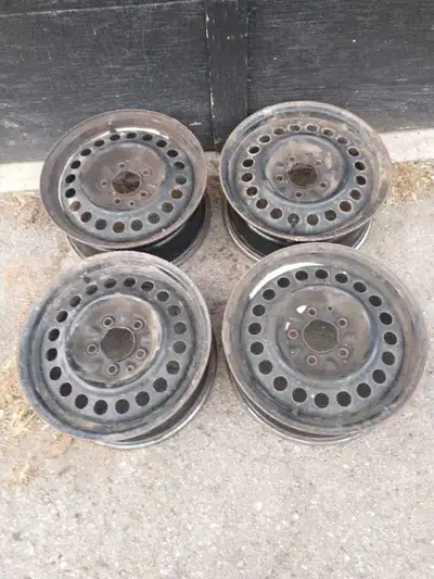 Set of 4 15 inch wheels. 6 inch width, 4.5 inch bolt circle, 74 mm centre hole. Came off 03 olds ale...