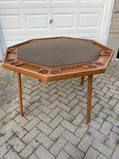 Great condition, solid wood, 8 person poker table. Drink holders, cash/chips holder area. Padded pla...