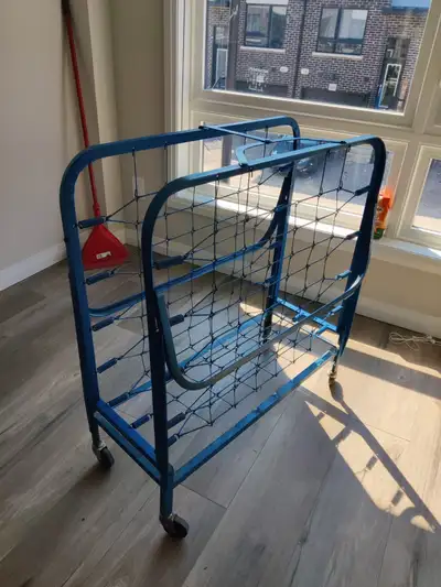 Heavy-duty folding metal cot/rollaway bed frame with wheels for easy storage and moving. Folds uprig...