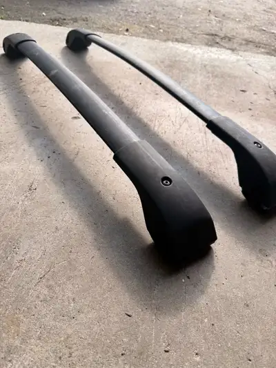 Subaru OEM crossbars, hatch rubber matting and rubber rear seat covers.