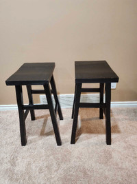 Black wooden stools