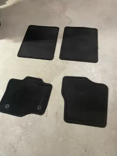 New carpet floor mat set to fit current F150's. Never used.