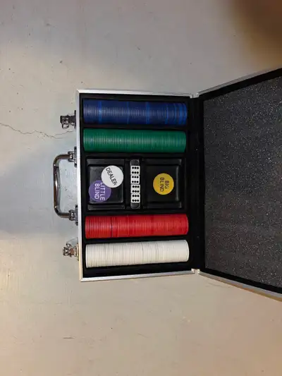 Poker chip set in a hard aluminum carry case. Includes chips (blue, green, red, white), dice, and De...