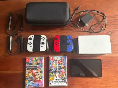 Nintendo switch OLED + 2 remotes + 2 games +case, View more