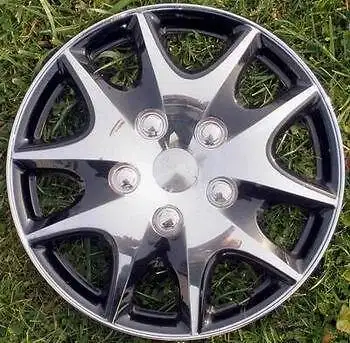 ..Set of 4. 14 inch Hub caps sporty like new. $65.