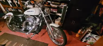 Harley Davidson 2005 Sportster Custom 1200cc XL. This a mid-sized, air-cooled V-twin motorcycle with...