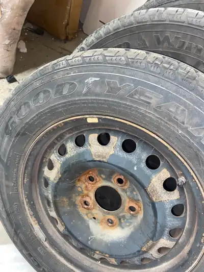 4 used Goodyear snow tires in good condition with 3 rims (rims are rusted) $300 for all