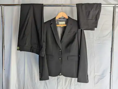 Banana Republic women's wool suit set consisting of matching black blazer, pencil skirt, and trouser...