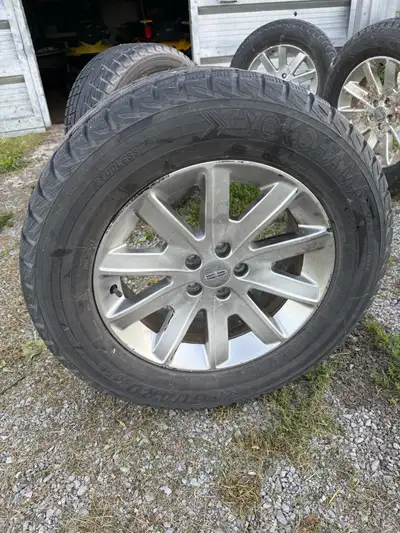 I am selling a set of used Yokohama IceGuard winter tires, size 265/60R18, mounted on Lincoln alloy...