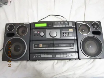 dual decks with auto reverse and music scan am fm tuner with presets timer sleep cd player bi amp 4...