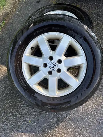I'm selling a set of used Honda rims with Continental tires, size 235/65R17, that are in good condit...