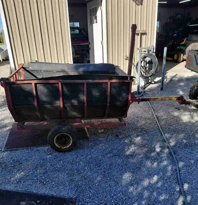 Small homemade dump trailer for yard work, hauling wood. Box measures 3 feet wide by 5 feet long and...