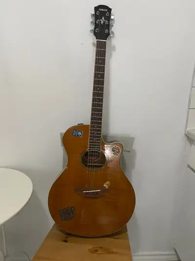 Yamaha slim body acoustic electric guitar with built in tuner., View more