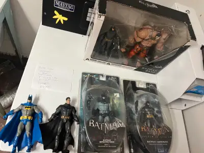 I'm selling a collection of used Batman action figures, including some from the Arkham Asylum series...