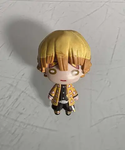 Zenitsu figure from Demon Slayer. It's in great condition and would be a perfect addition to any ani...