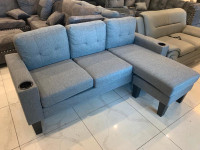 Elegant Fabric Sectional with Reversible Stool only $399.