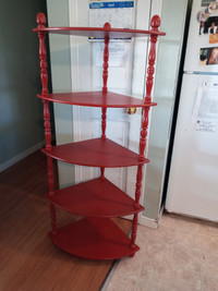 Solid wood corner shelf in red.