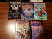 Fantasy and sci-fi hardcover and paperback books