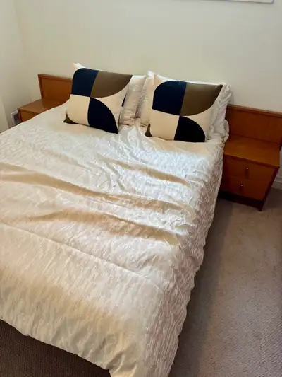 Beautiful solid teak bed frame with built-in nightstands on both sides. Very high-quality, heavy pie...