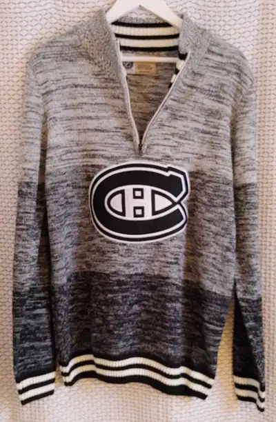 Men's size large Montreal Canadiens half zip up sweater. Black, grey and white. Excellent condition....