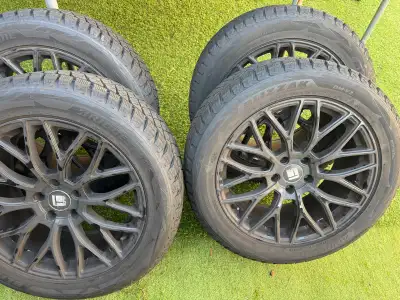 These Bridgestone Blizzak winter tires are mounted on rims and ready to tackle Canadian winter roads...