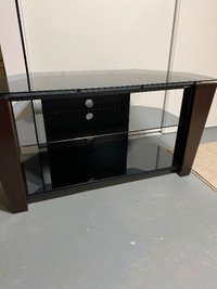 Glass/dark wood tv stand. Excellent condition
